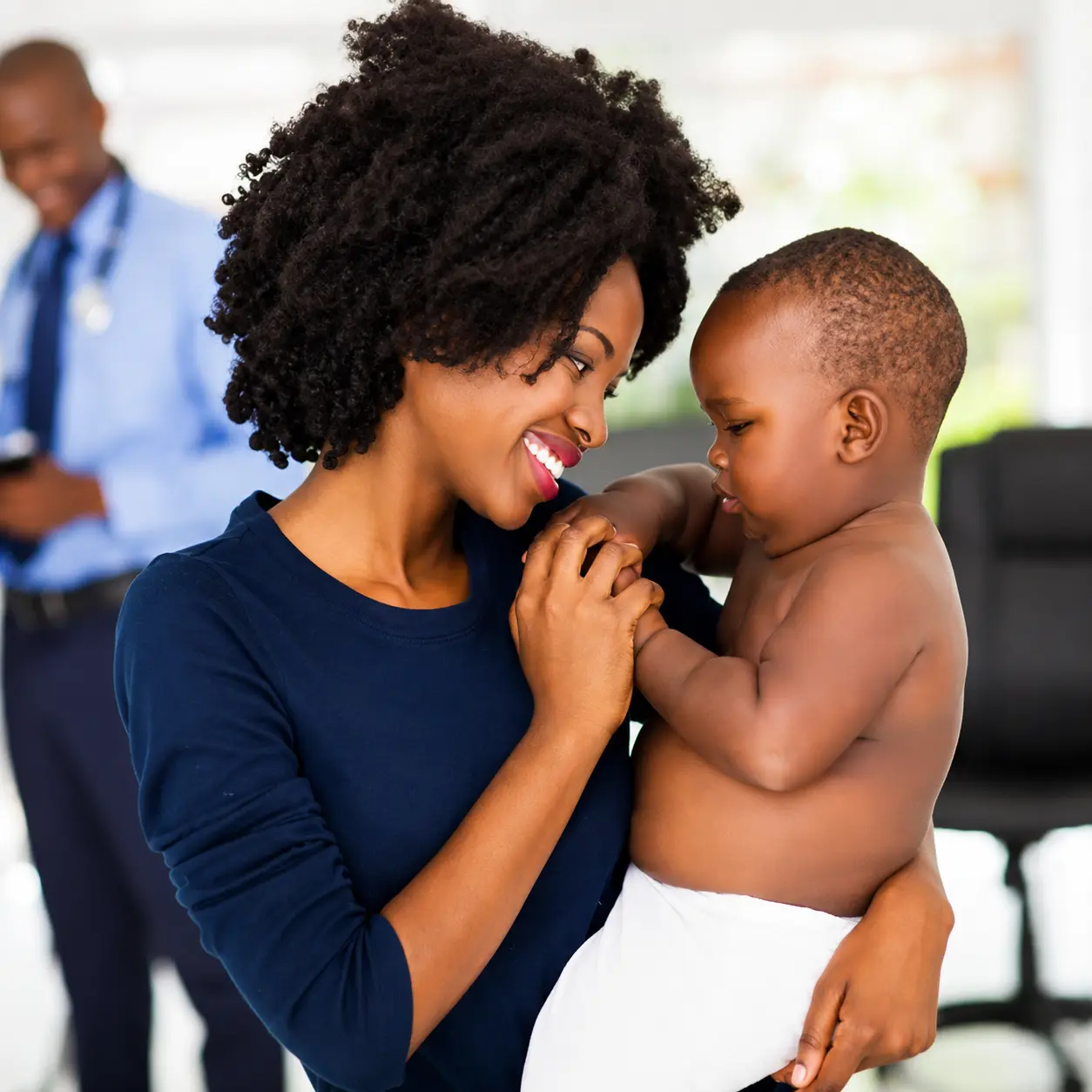 Mother holding her child providing comfort and maternal mental health support